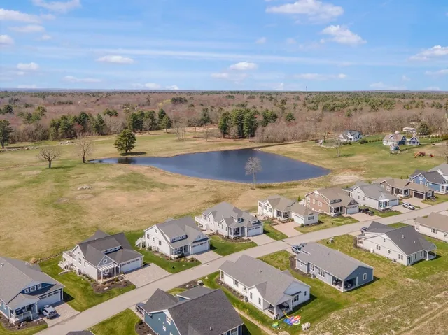 an aerial view of residential houses with outdoor space