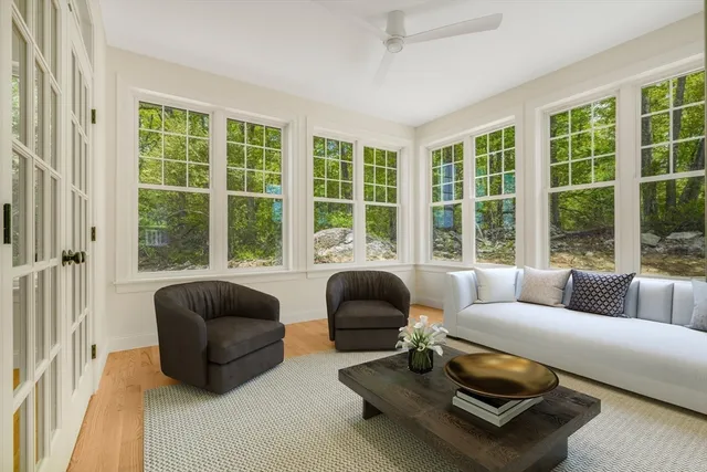 a spacious bedroom with a bed and a couch