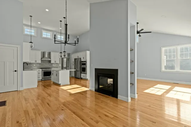 a kitchen with stainless steel appliances a stove refrigerator sink and cabinets