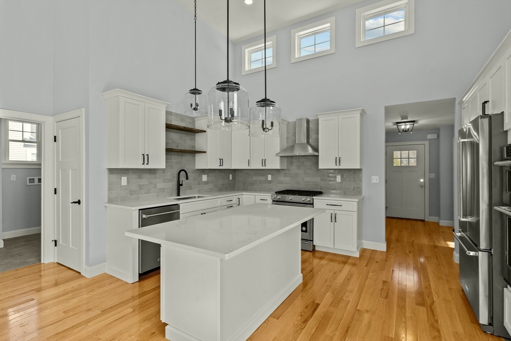 47 Spring Street Rehoboth, MA 02769 - Photo 17 of 35 a kitchen with stainless steel appliances a stove refrigerator sink and cabinets