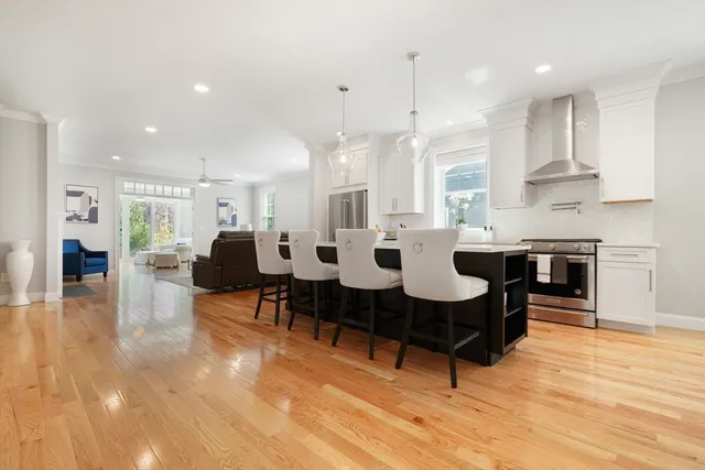 a bathroom with a bathtub shower sink mirror and toilet