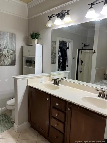 a bathroom with a sink double vanity and a mirror