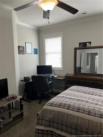a bedroom with a bed and a couch