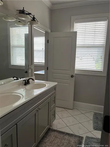 a bathroom with a sink a vanity and a mirror