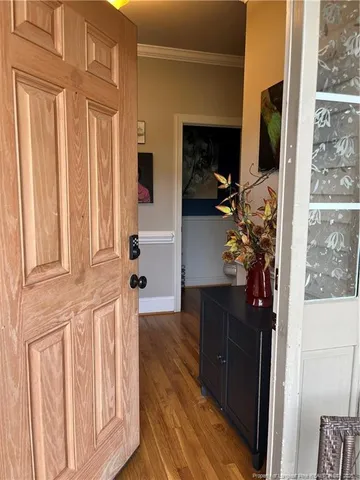 a view of hallway with wooden floor