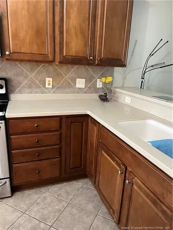 a kitchen with a sink and cabinets
