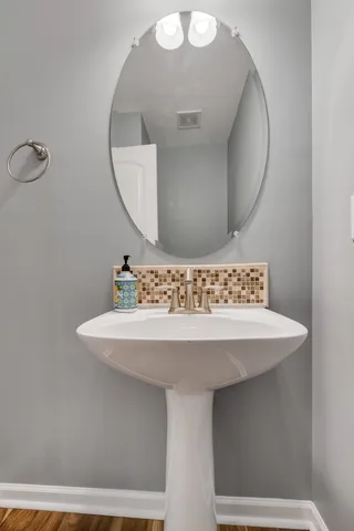 a bathroom with a sink and a mirror