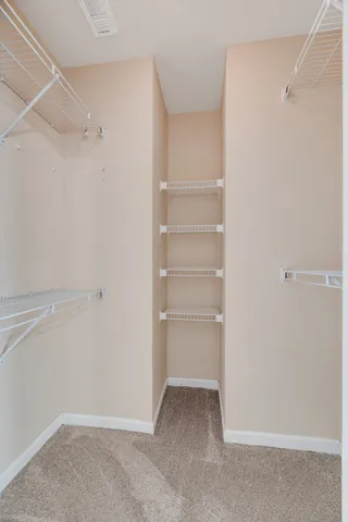 a view of an empty walk in closet