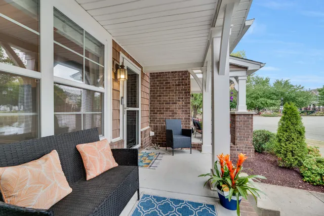 a outdoor living space with patio furniture and potted plants