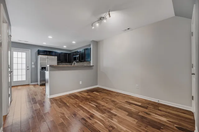 a view of kitchen with wooden floor
