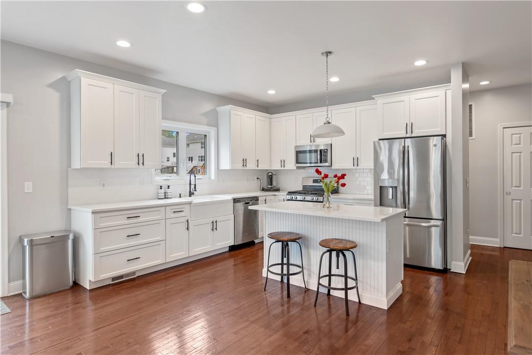 56 North Ridge Road Mahopac, NY 10541 - Photo 1 of 1 a kitchen with white cabinets stainless steel appliances and kitchen island