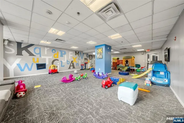 a living room with fireplace furniture and a flat screen tv