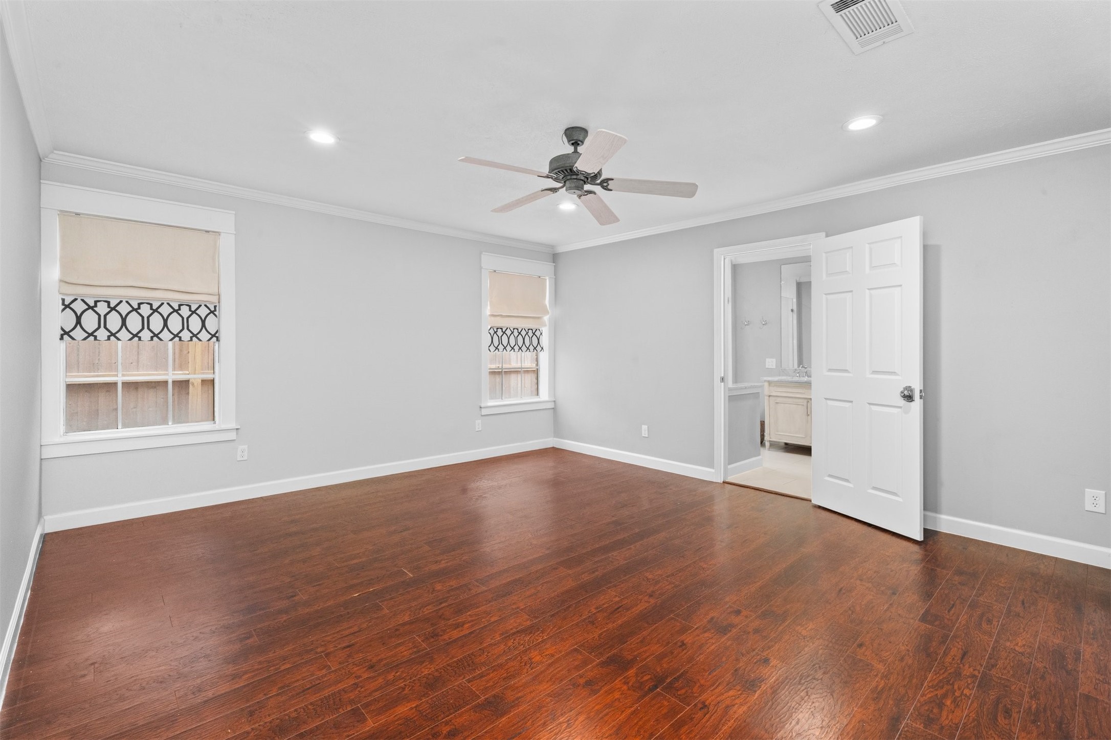 602 Aldersgate Court Katy, TX 77450 - Photo 10 of 24 a view of an empty room with wooden floor and a window
