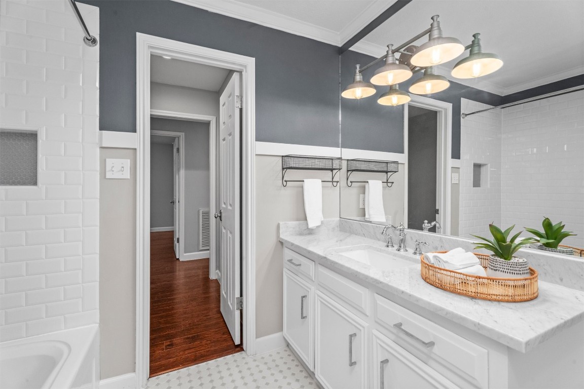 602 Aldersgate Court Katy, TX 77450 - Photo 14 of 24 a bathroom with a sink a light fixture and a mirror
