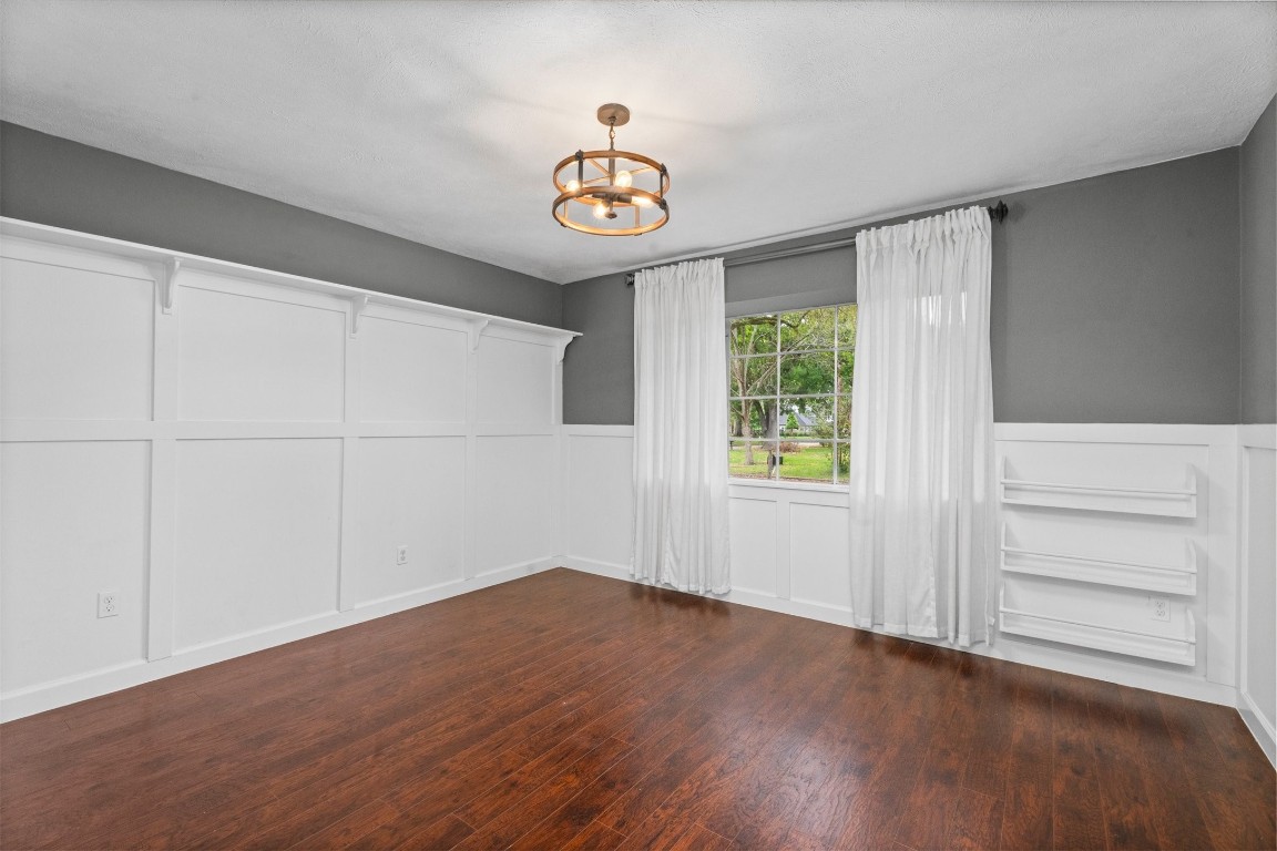 602 Aldersgate Court Katy, TX 77450 - Photo 16 of 24 wooden floor in an empty room with a window