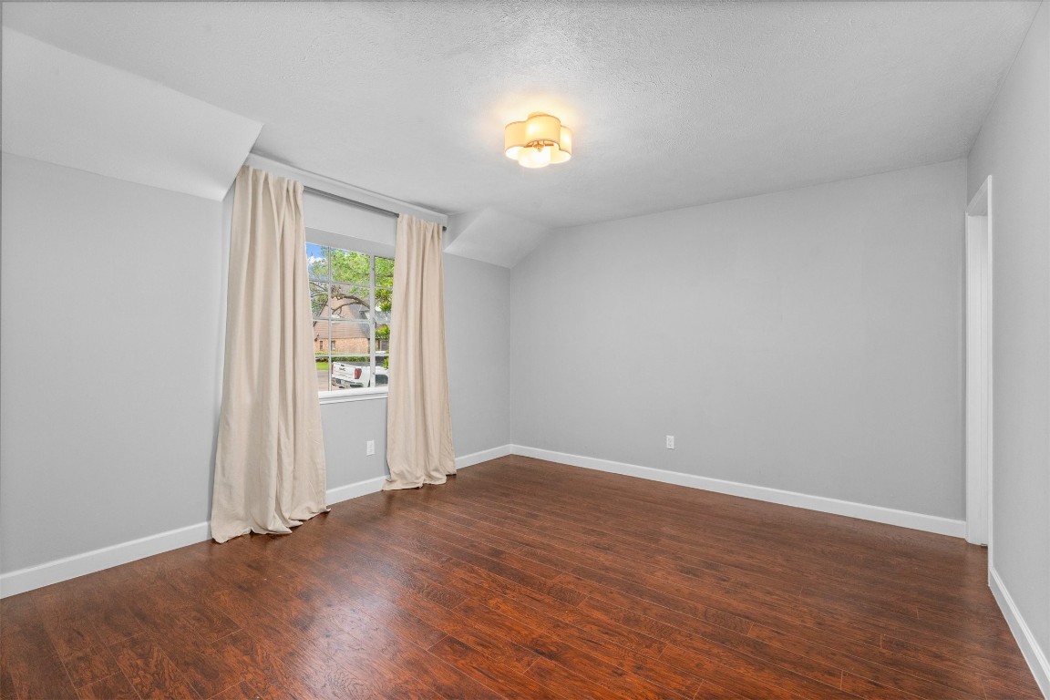 602 Aldersgate Court Katy, TX 77450 - Photo 17 of 24 an empty room with wooden floor and windows