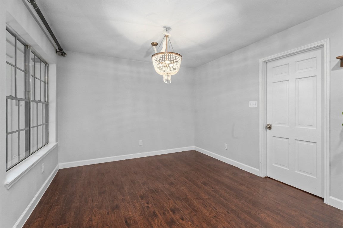602 Aldersgate Court Katy, TX 77450 - Photo 19 of 24 wooden floor in an empty room with a window