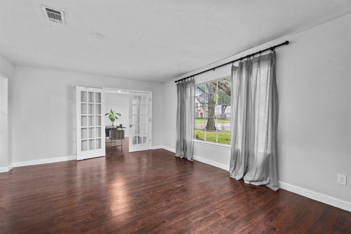 602 Aldersgate Court Katy, TX 77450 - Photo 20 of 24 a view of an empty room with wooden floor and a window