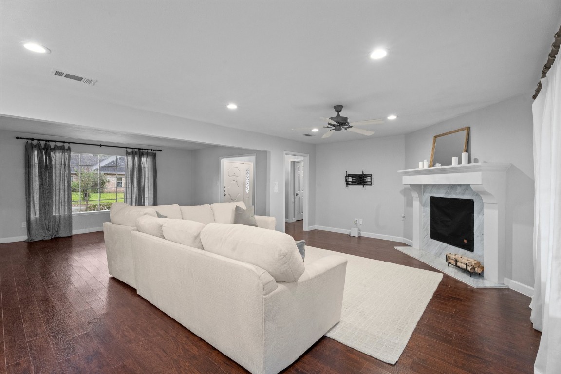 602 Aldersgate Court Katy, TX 77450 - Photo 24 of 24 a living room with furniture and a fireplace
