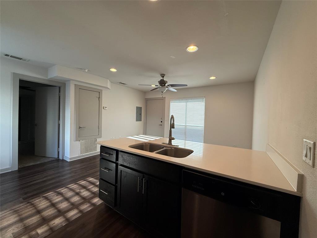 2106 Bennett Avenue, Unit 106 Dallas, TX 75206 - Photo 12 of 14 a kitchen with a sink and cabinets