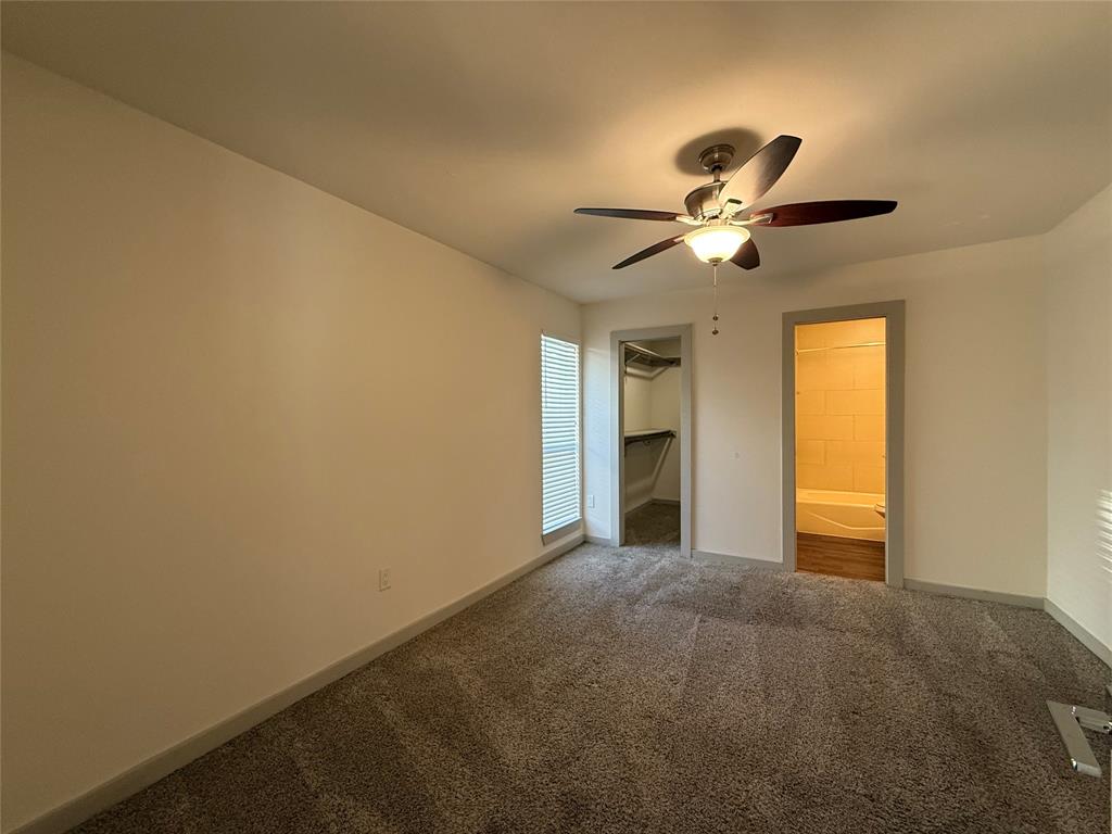 2106 Bennett Avenue, Unit 106 Dallas, TX 75206 - Photo 5 of 14 a view of room with a ceiling fan and a window