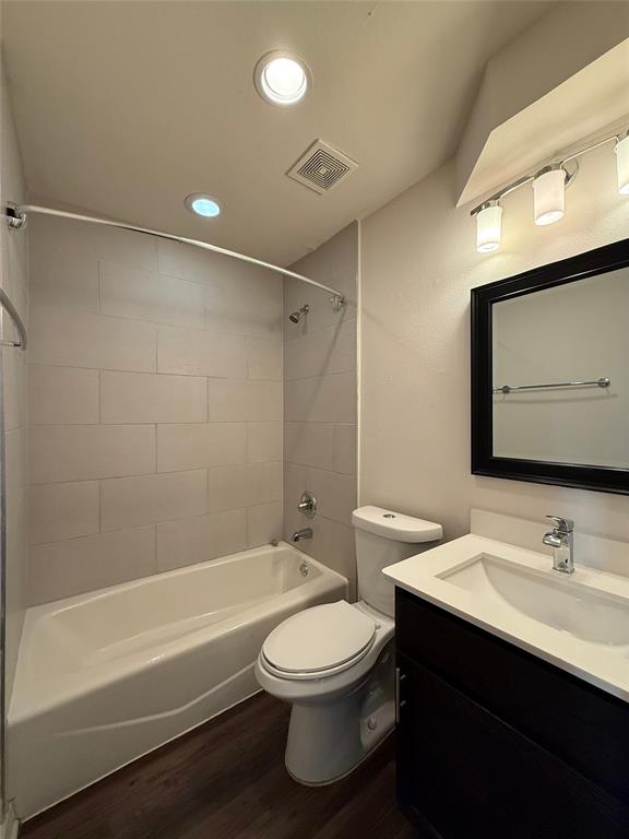 2106 Bennett Avenue, Unit 106 Dallas, TX 75206 - Photo 7 of 14 a bathroom with a sink a toilet and shower