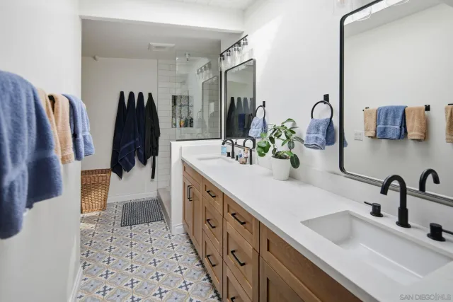 a view of a dining room with furniture a chandelier and wooden floor