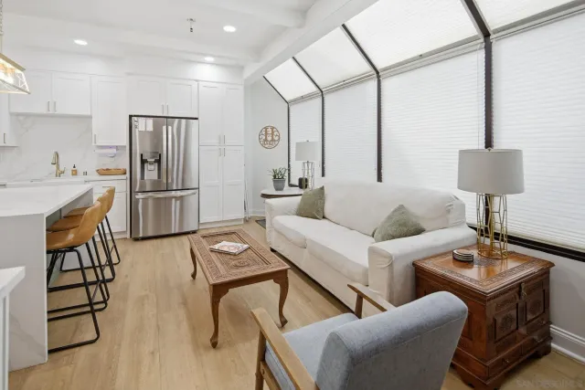a kitchen with a stove and a white refrigerator