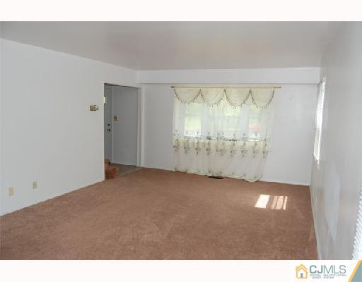 8 Tamarack Road Somerset, NJ 08873 - Photo 3 of 8 a view of an empty room and window