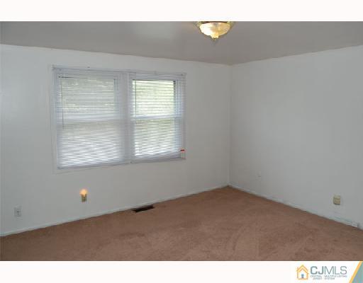 8 Tamarack Road Somerset, NJ 08873 - Photo 6 of 8 an empty room with a window