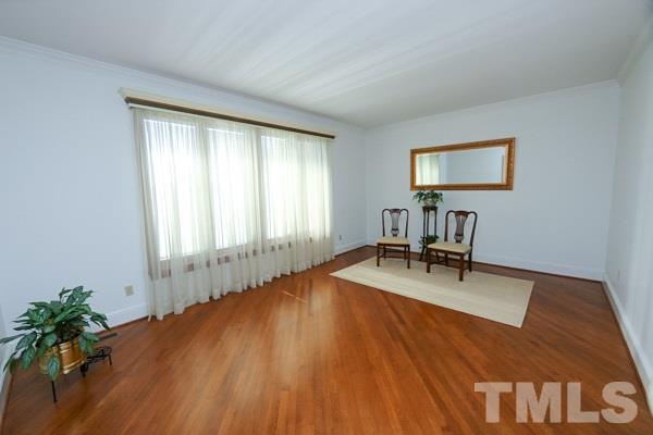 5712 Crutchfield Road Raleigh, NC 27606 - Photo 7 of 21 Formal living room w/ hardwood floors