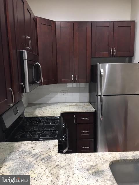 432 Tasker Street Philadelphia, PA 19148 - Photo 13 of 33 Cherry wood
cabinets