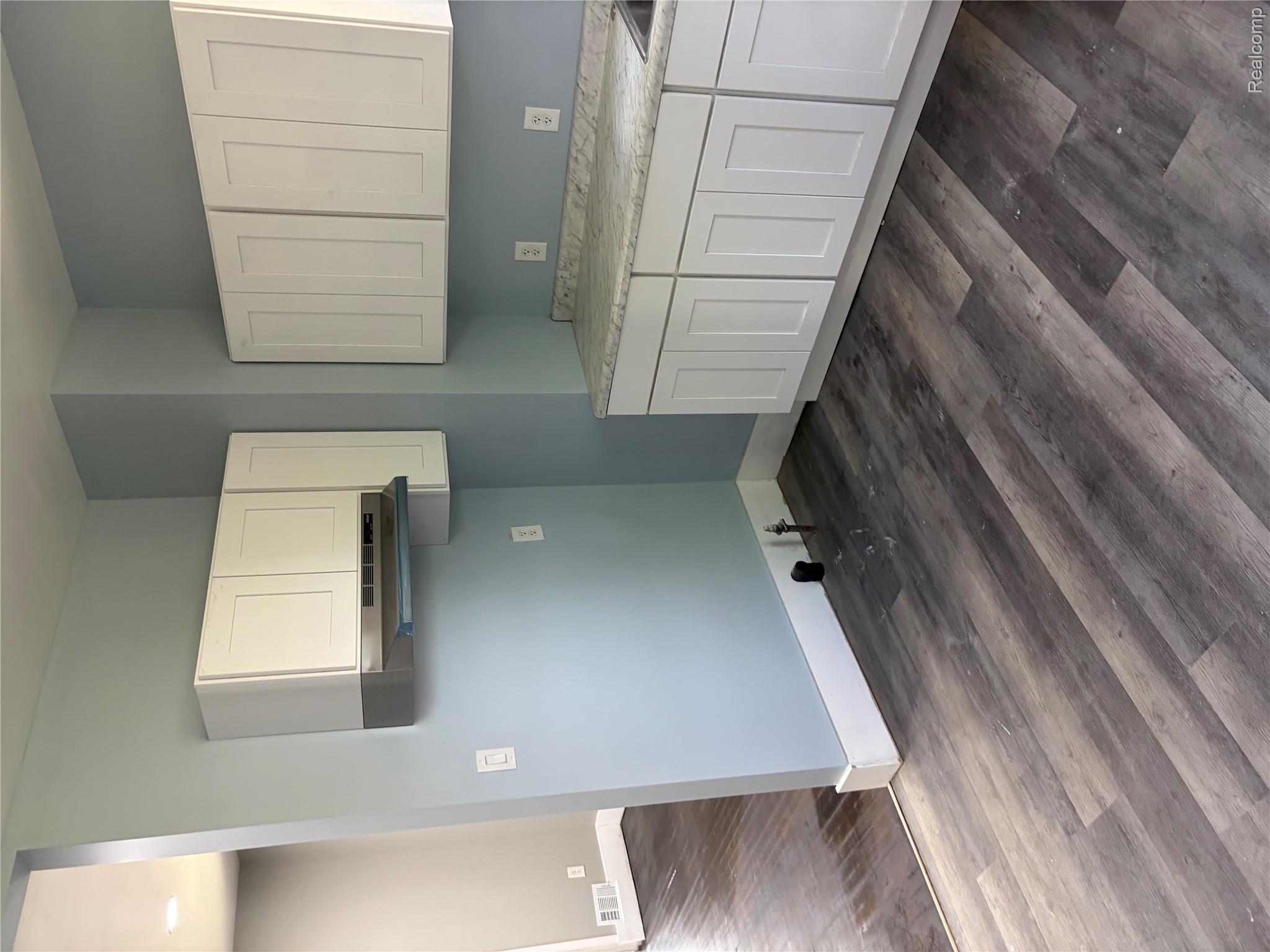 2420 Field Street Detroit, MI 48214 - Photo 7 of 15 Laundry room with dark wood-type flooring