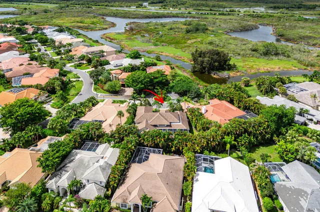 an aerial view of residential houses with outdoor space and street view
