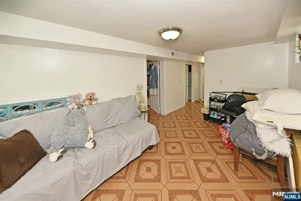 a bed sitting in a room next to a window