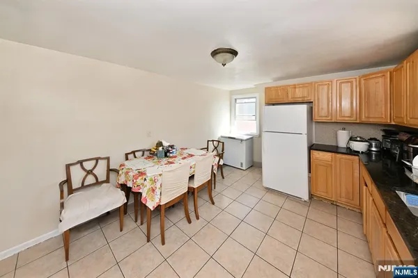 a kitchen with a white cabinets and white appliances