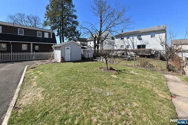 a view of a back yard of the house