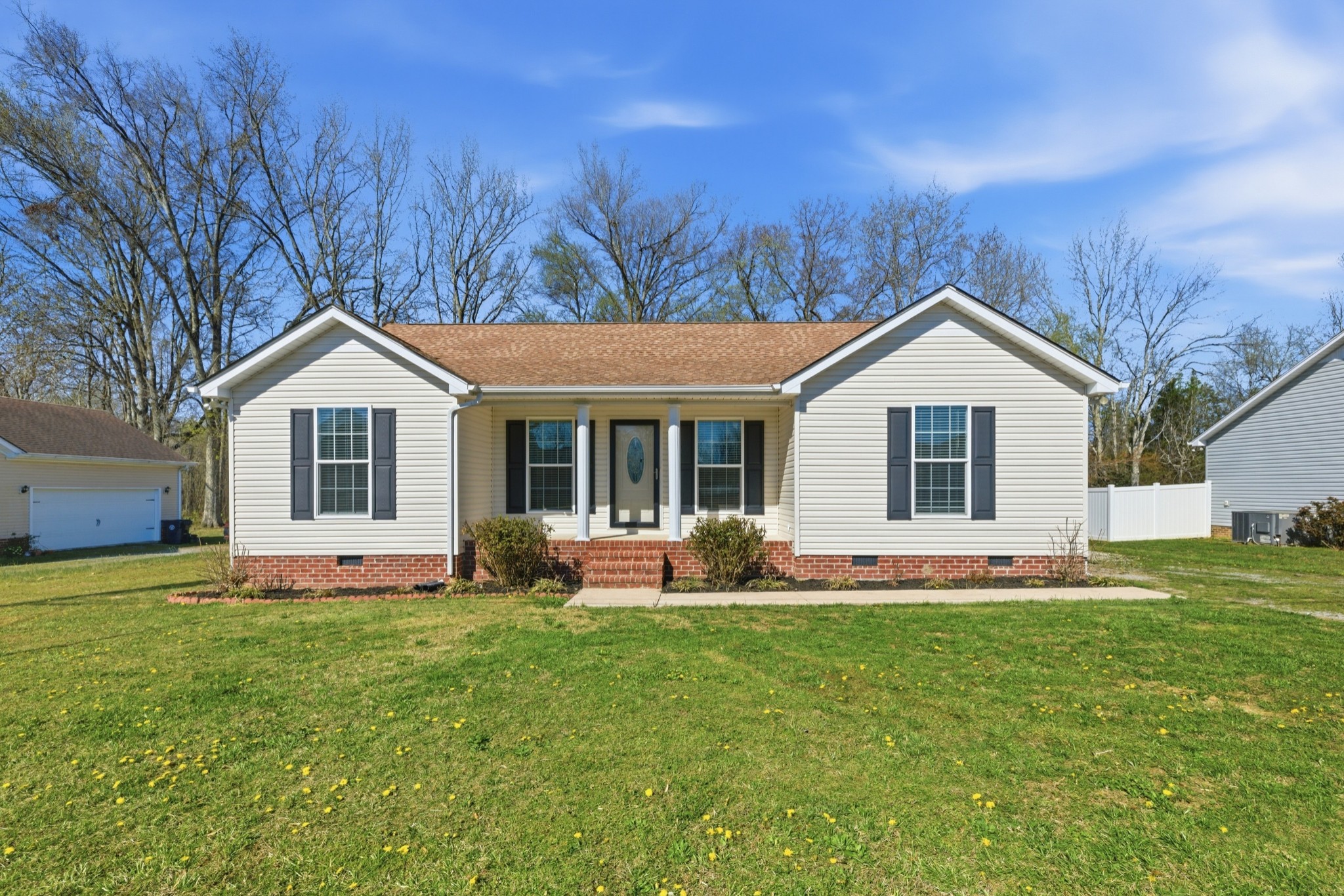 217 Spring Breeze Drive Smithville, TN 37166 - Photo 1 of 34 a front view of house with yard and green space
