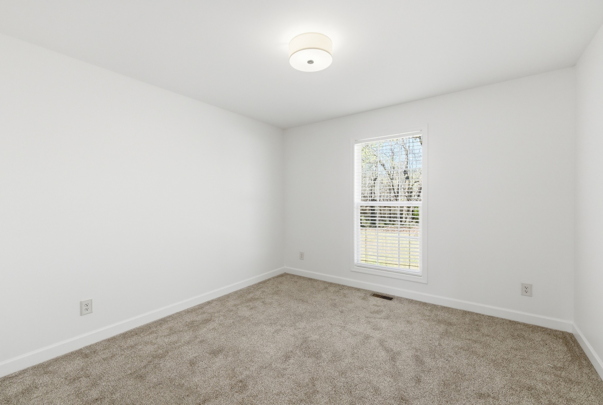 217 Spring Breeze Drive Smithville, TN 37166 - Photo 23 of 34 an empty room with windows