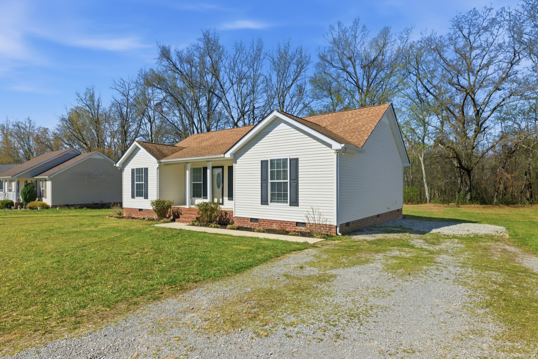 217 Spring Breeze Drive Smithville, TN 37166 - Photo 28 of 34 a front view of house with yard and green space