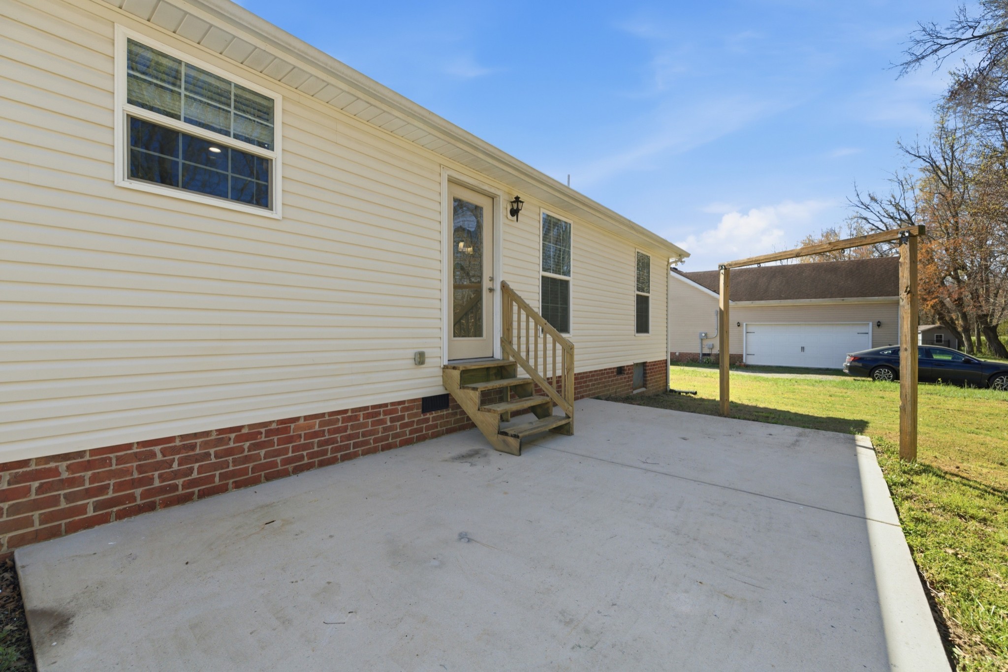 217 Spring Breeze Drive Smithville, TN 37166 - Photo 34 of 34 a view of a house with backyard and sitting area