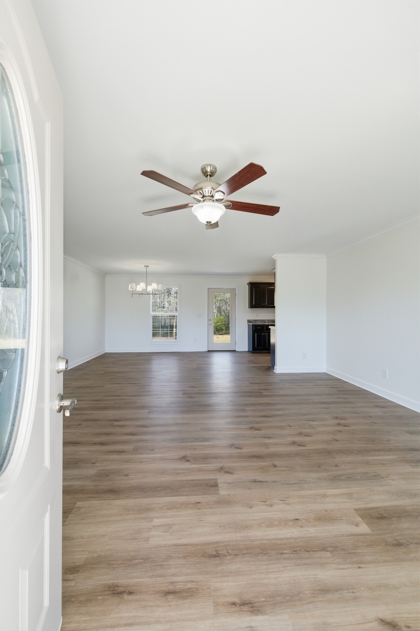 217 Spring Breeze Drive Smithville, TN 37166 - Photo 5 of 34 a view of empty room with wooden floor and fan