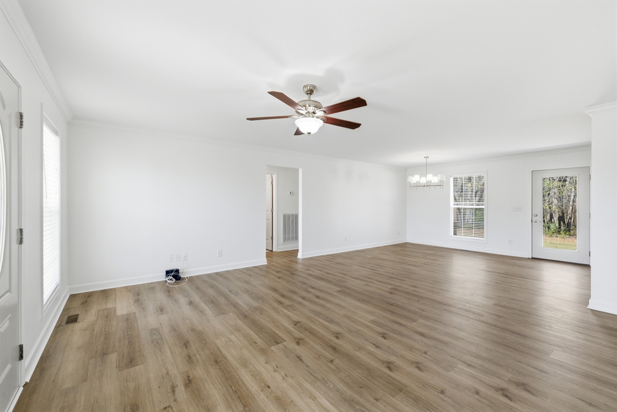 217 Spring Breeze Drive Smithville, TN 37166 - Photo 8 of 34 a view of empty room with wooden floor and fan