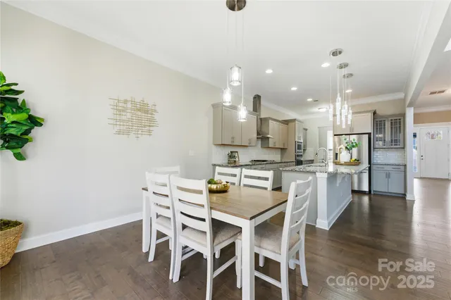 a kitchen with a table and chairs in it
