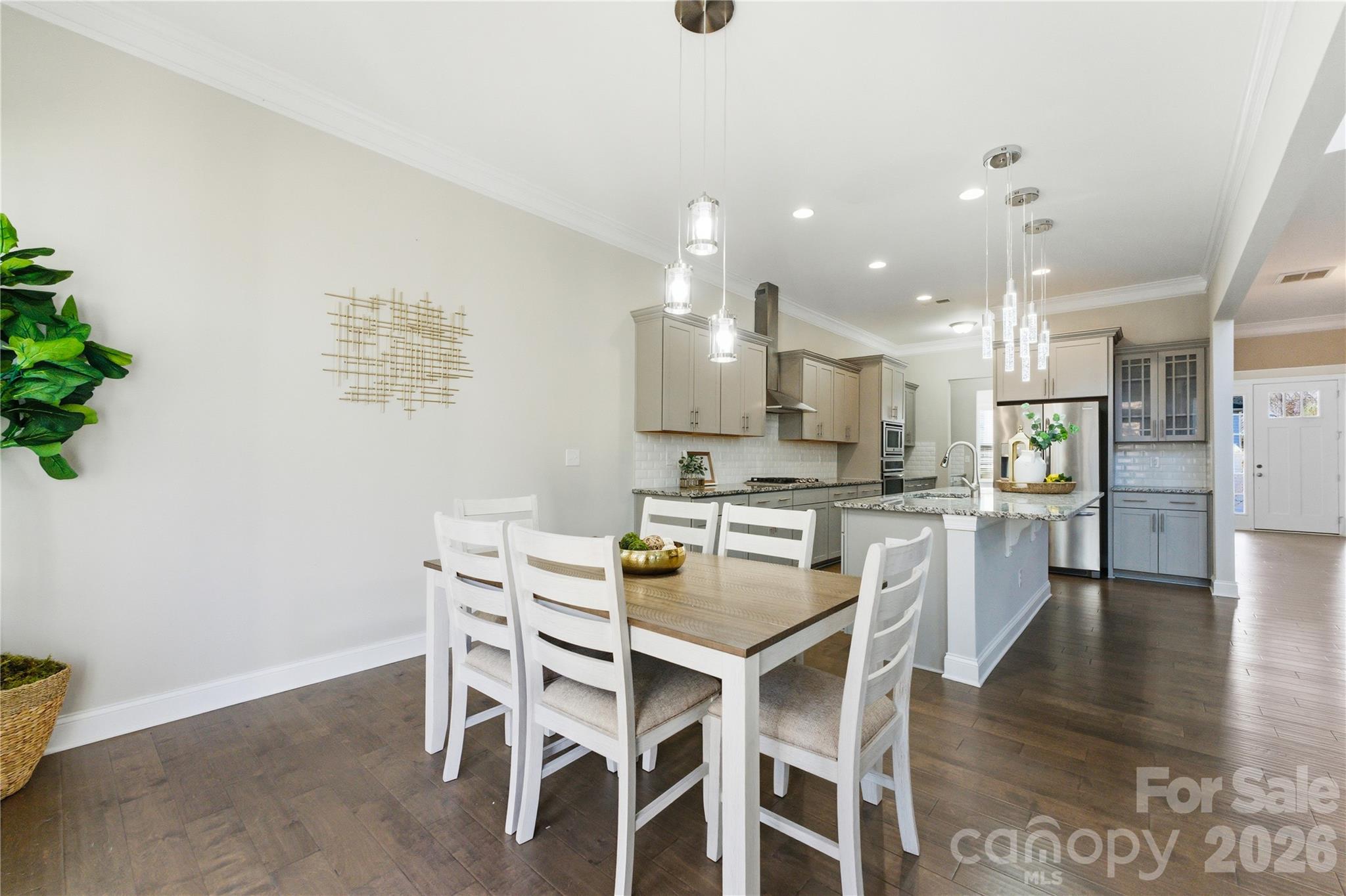 194 Forsythia Lane Tega Cay, SC 29708 - Photo 17 of 37 a kitchen with a table and chairs in it