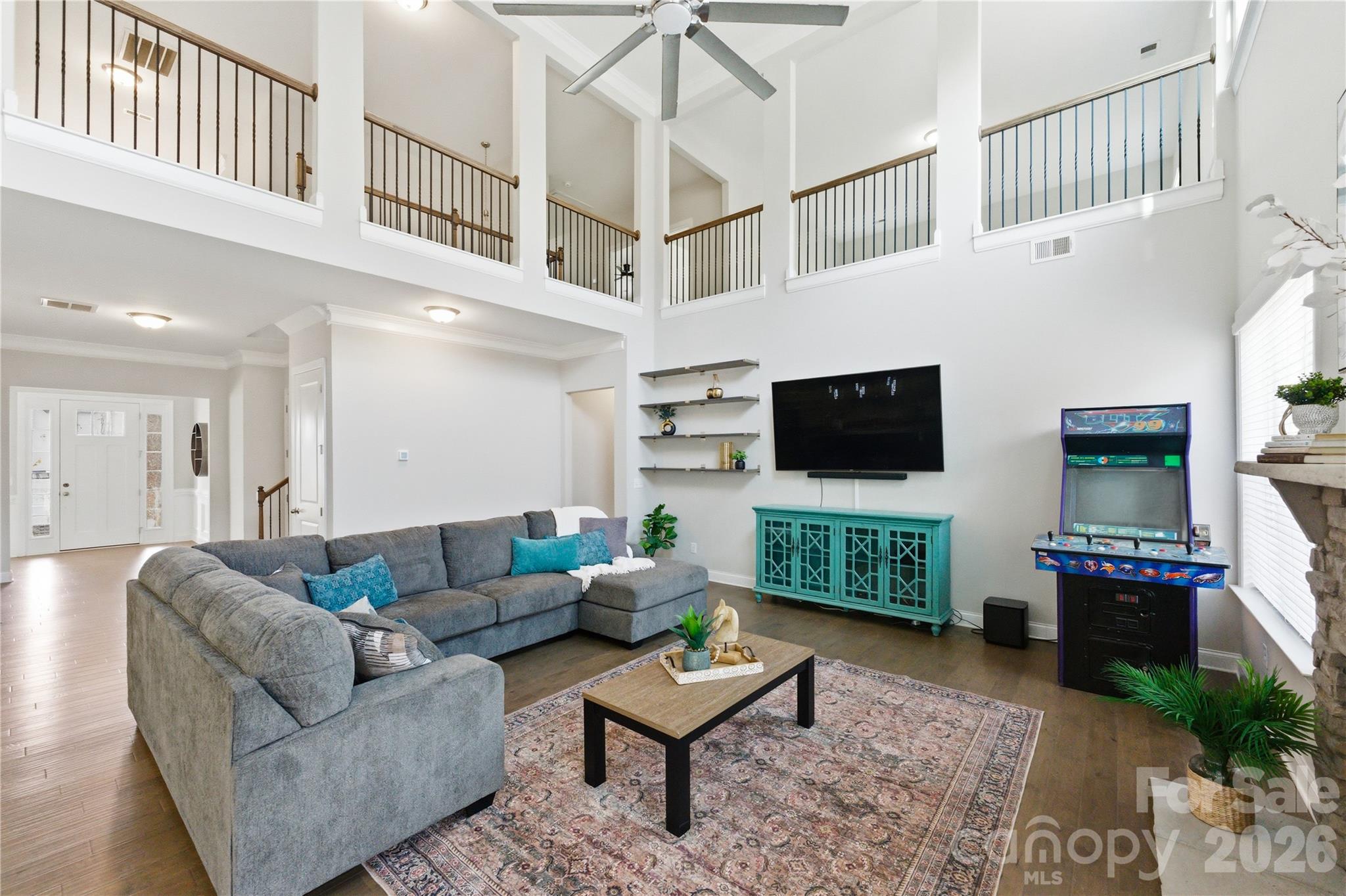 194 Forsythia Lane Tega Cay, SC 29708 - Photo 19 of 37 a living room with furniture a flat screen tv and a fireplace