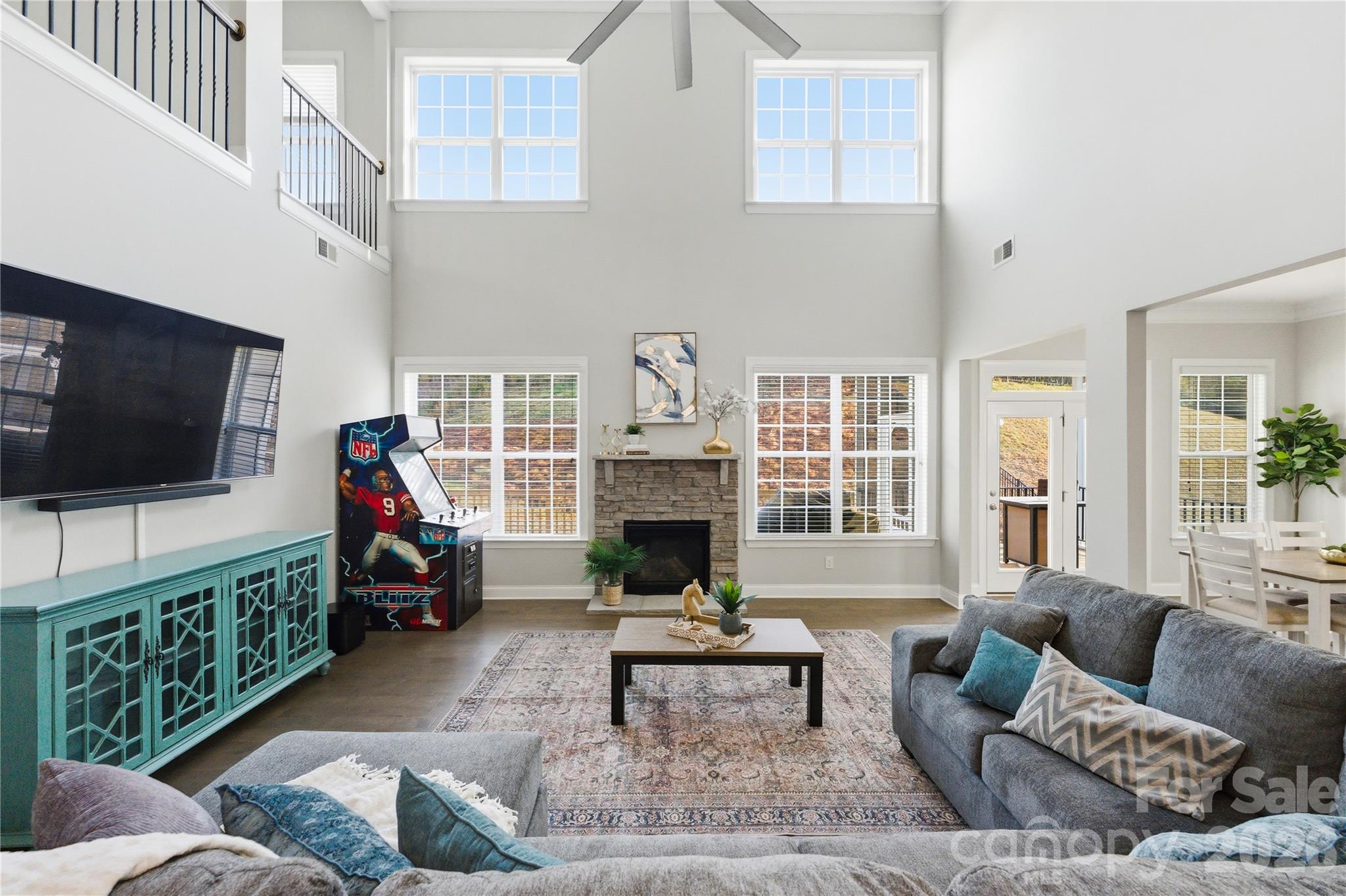 194 Forsythia Lane Tega Cay, SC 29708 - Photo 19 of 36 a living room with furniture a flat screen tv and a fireplace