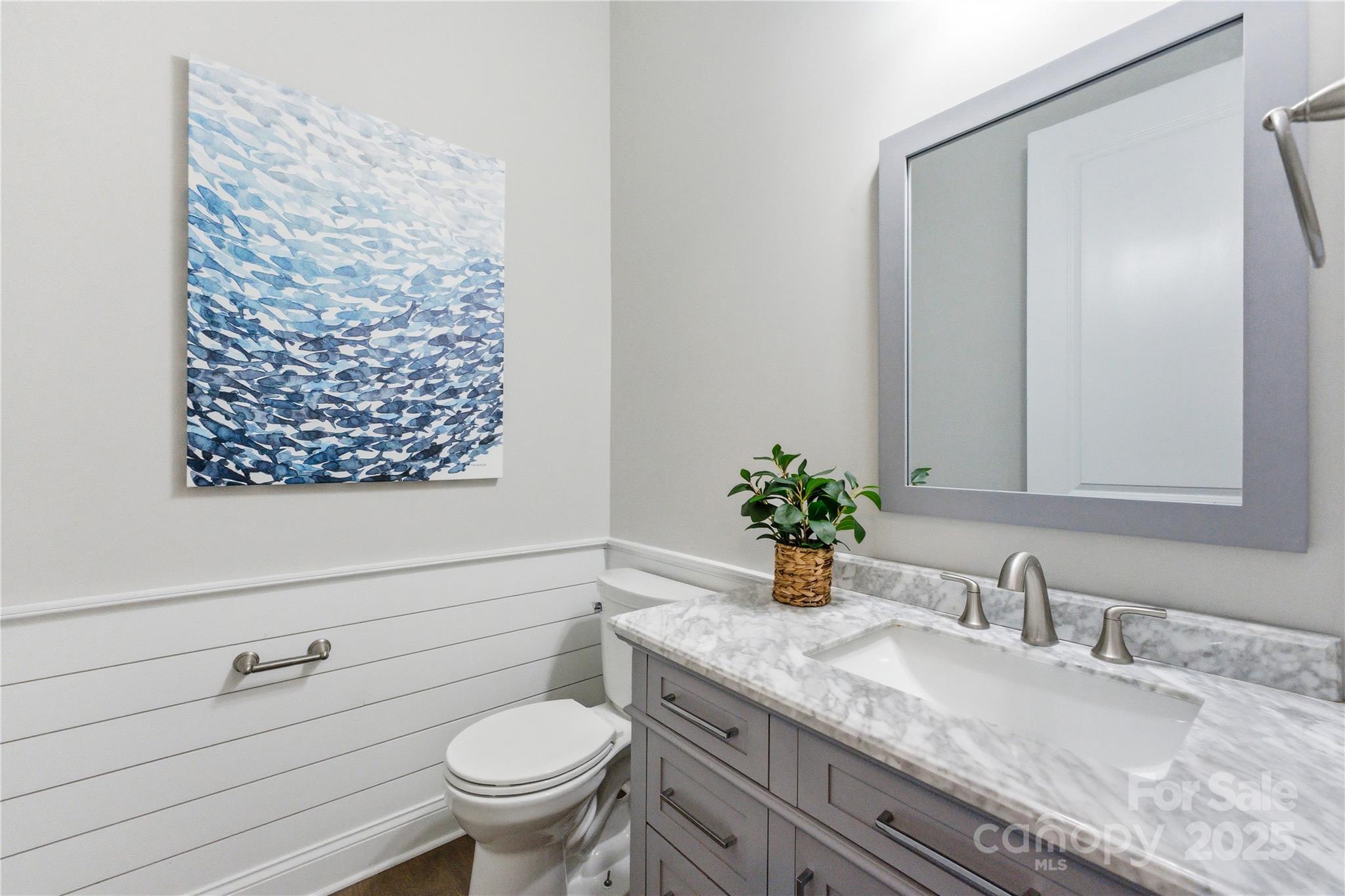 194 Forsythia Lane Tega Cay, SC 29708 - Photo 21 of 31 a bathroom with a granite countertop sink a toilet and a mirror
