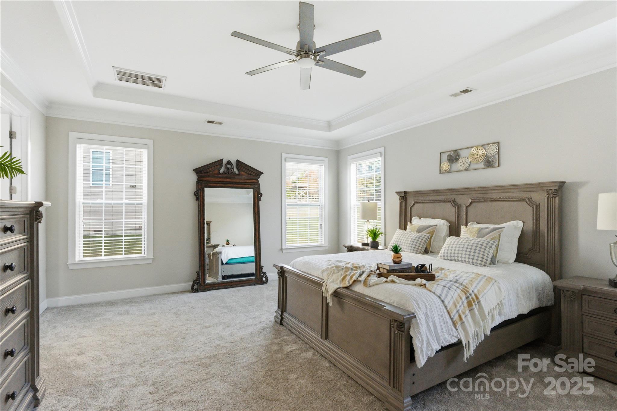 194 Forsythia Lane Tega Cay, SC 29708 - Photo 22 of 31 a bedroom with a large bed and a tv