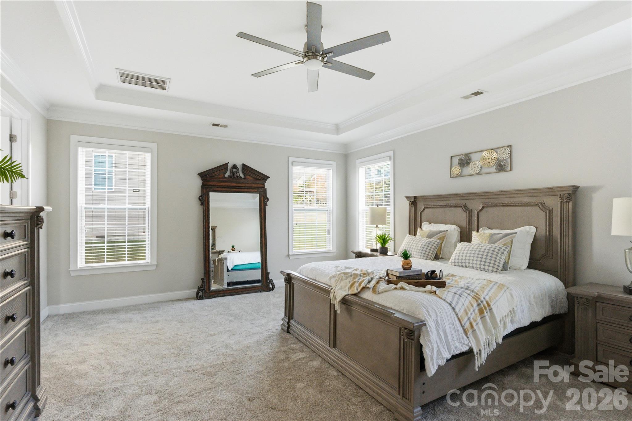 194 Forsythia Lane Tega Cay, SC 29708 - Photo 22 of 36 a bedroom with a large bed and a tv